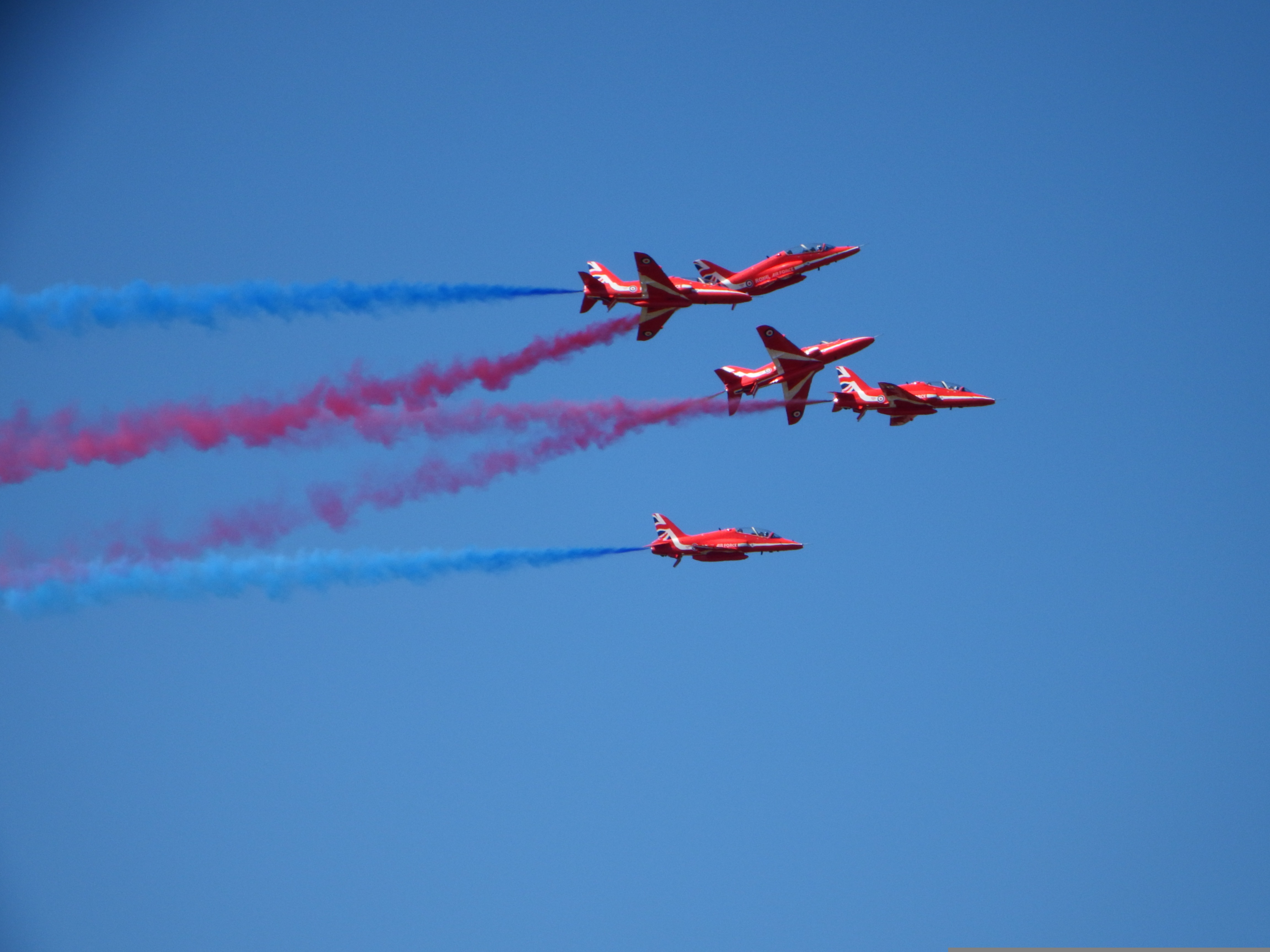 Red Arrows coloured smoke trails